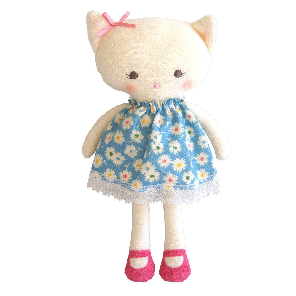 Stuffed kitten doll in a blue floral dress and pink shoes.