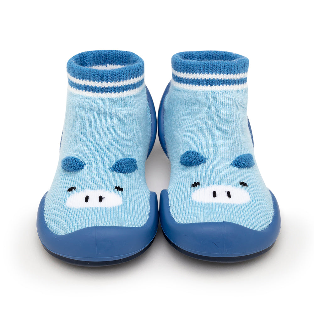 Pair of blue baby sock shoes with cartoon hippo face.