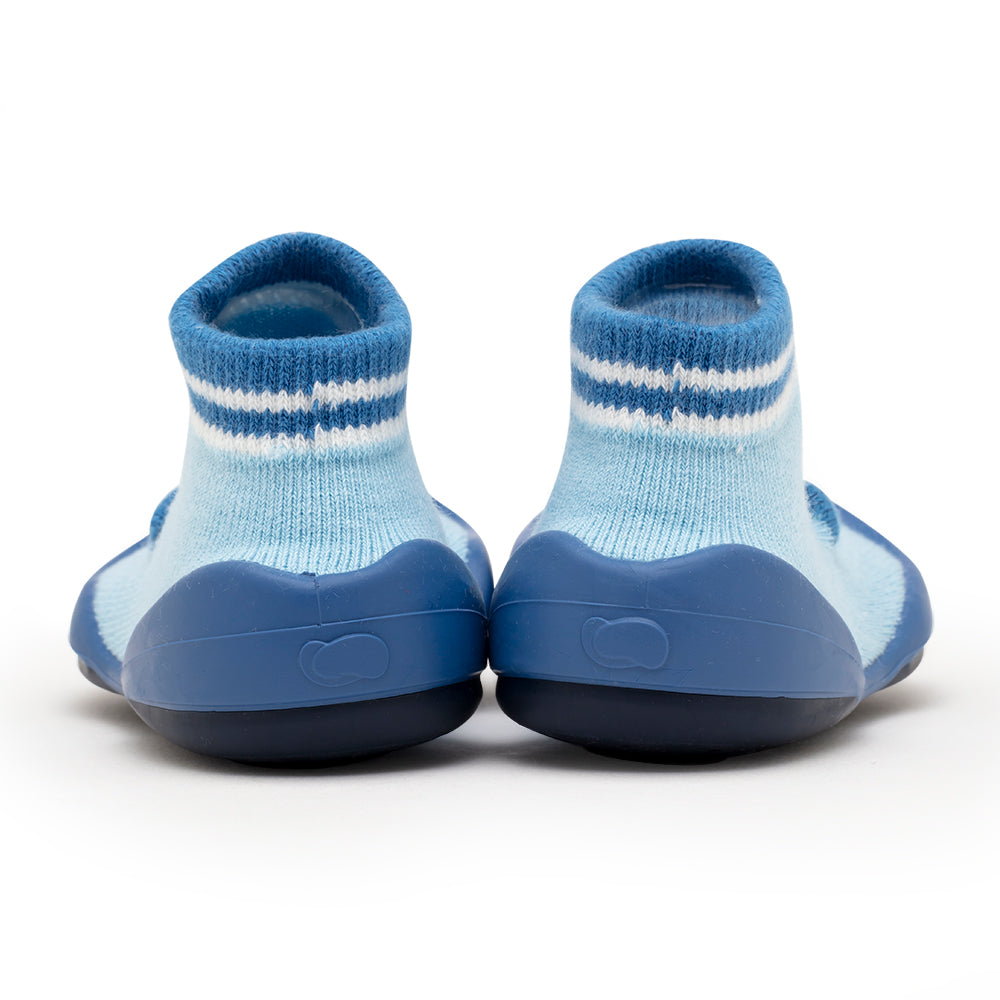 Two light-blue and blue baby shoes, rear view, on white background.
