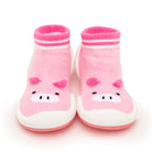 Pink baby sock shoes with pig design.