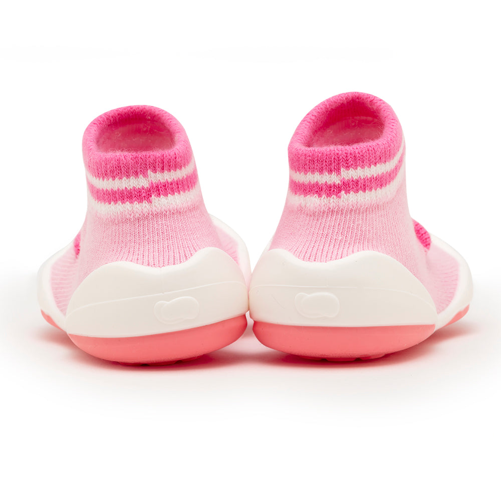 Back view of pink and white striped baby shoes.
