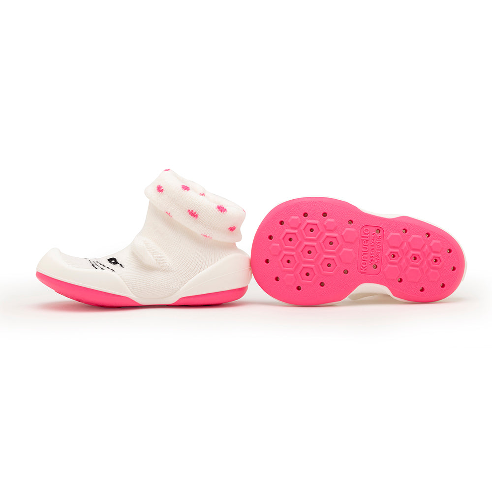 Pink and white baby shoes.