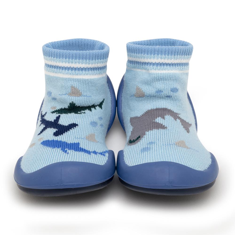 Two blue baby slipper socks with a shark design.