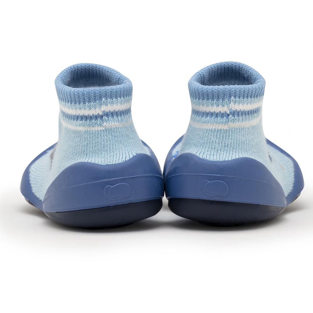 Two blue baby sock-shoes.