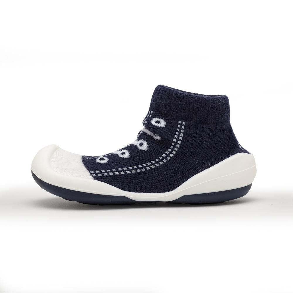 Navy blue sock shoe with white accents.