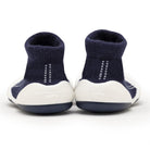 Two navy blue and white baby sock shoes.