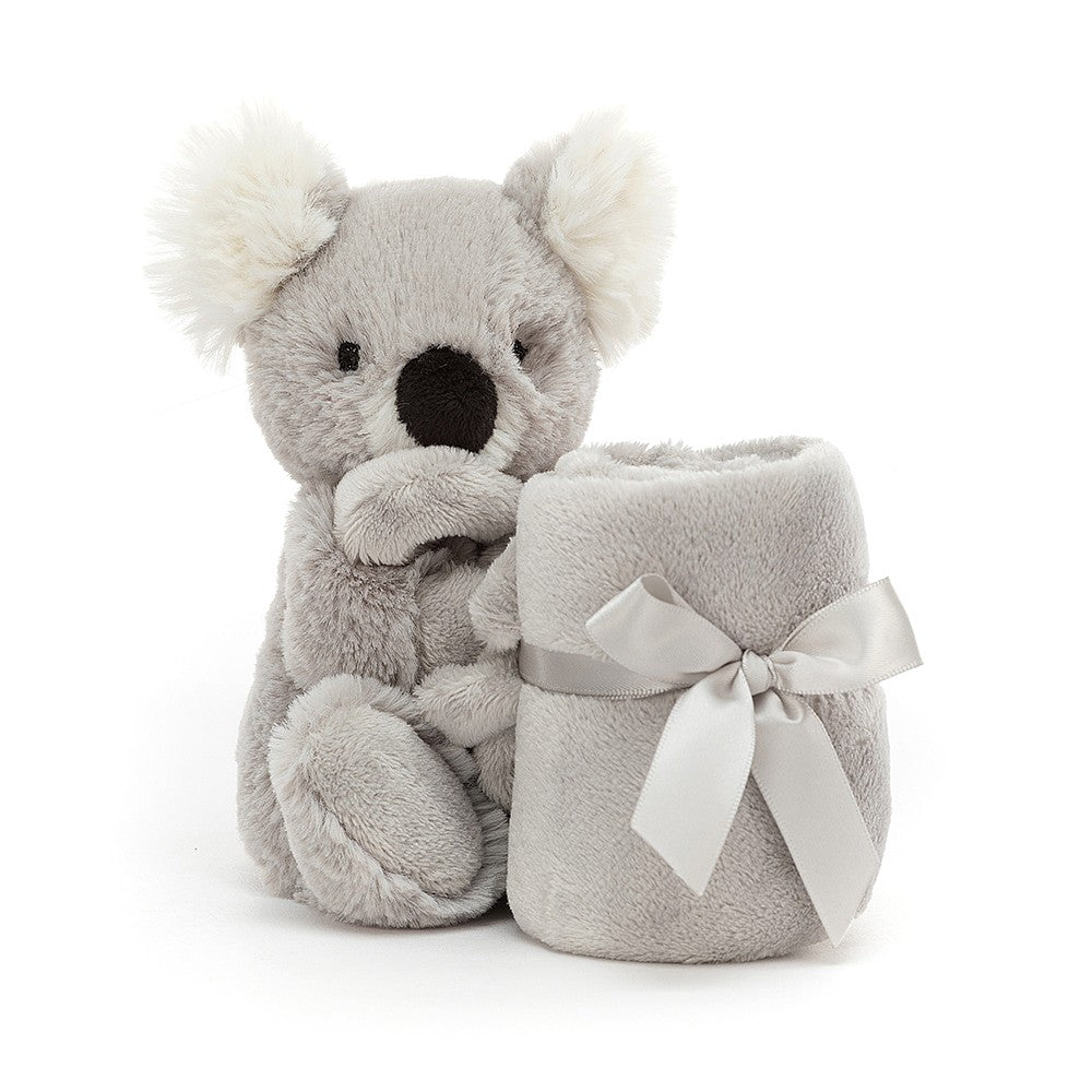 Gray plush koala bear with blanket and silver ribbon.