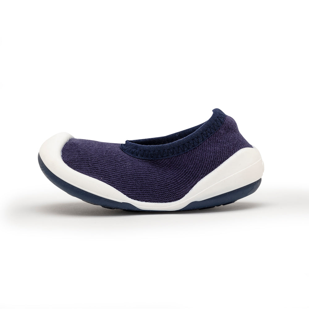 Blue knit shoe with white sole.