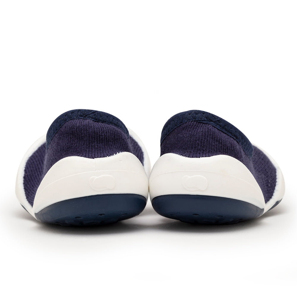 Navy blue and white baby shoes.