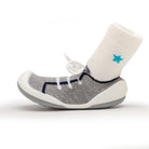 Gray sock-shoe with white sock and blue star.