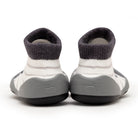Back view of gray and white striped baby shoes.