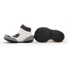 Pair of baby sock shoes, one upright and one with sole showing, grey trim, stripes, raccoon face.