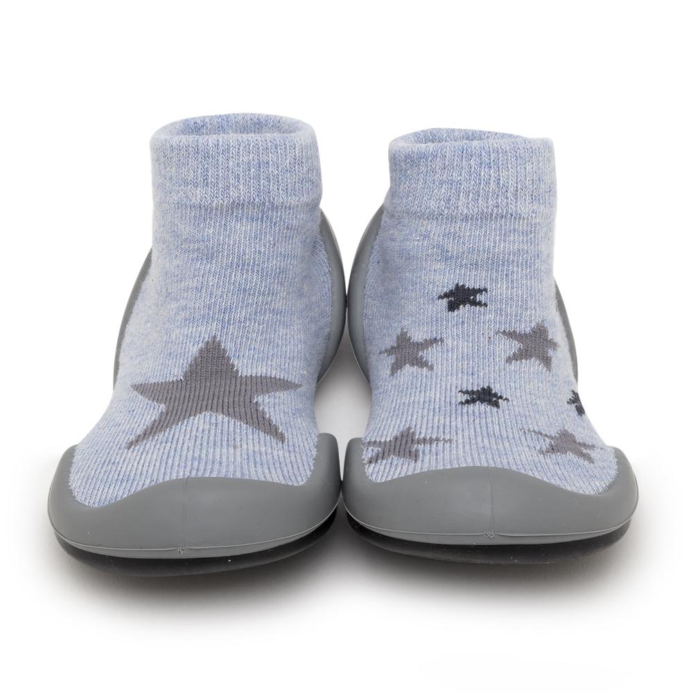 Front view of baby blue sock shoes with star print and gray rubber soles.