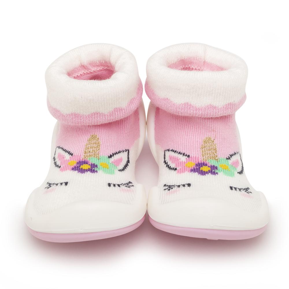 Pair of baby slipper socks. White and pink fabric, unicorn design.