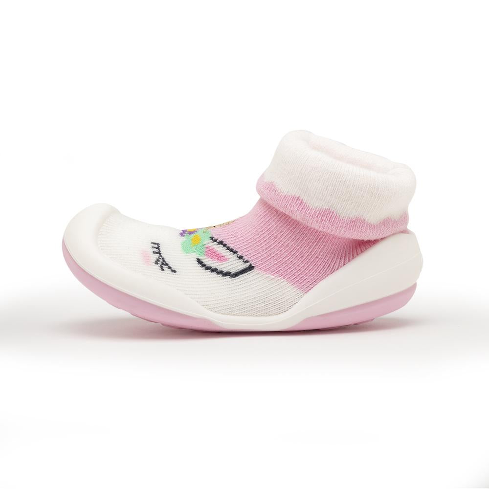 Pink and white baby sock-shoe with unicorn design.