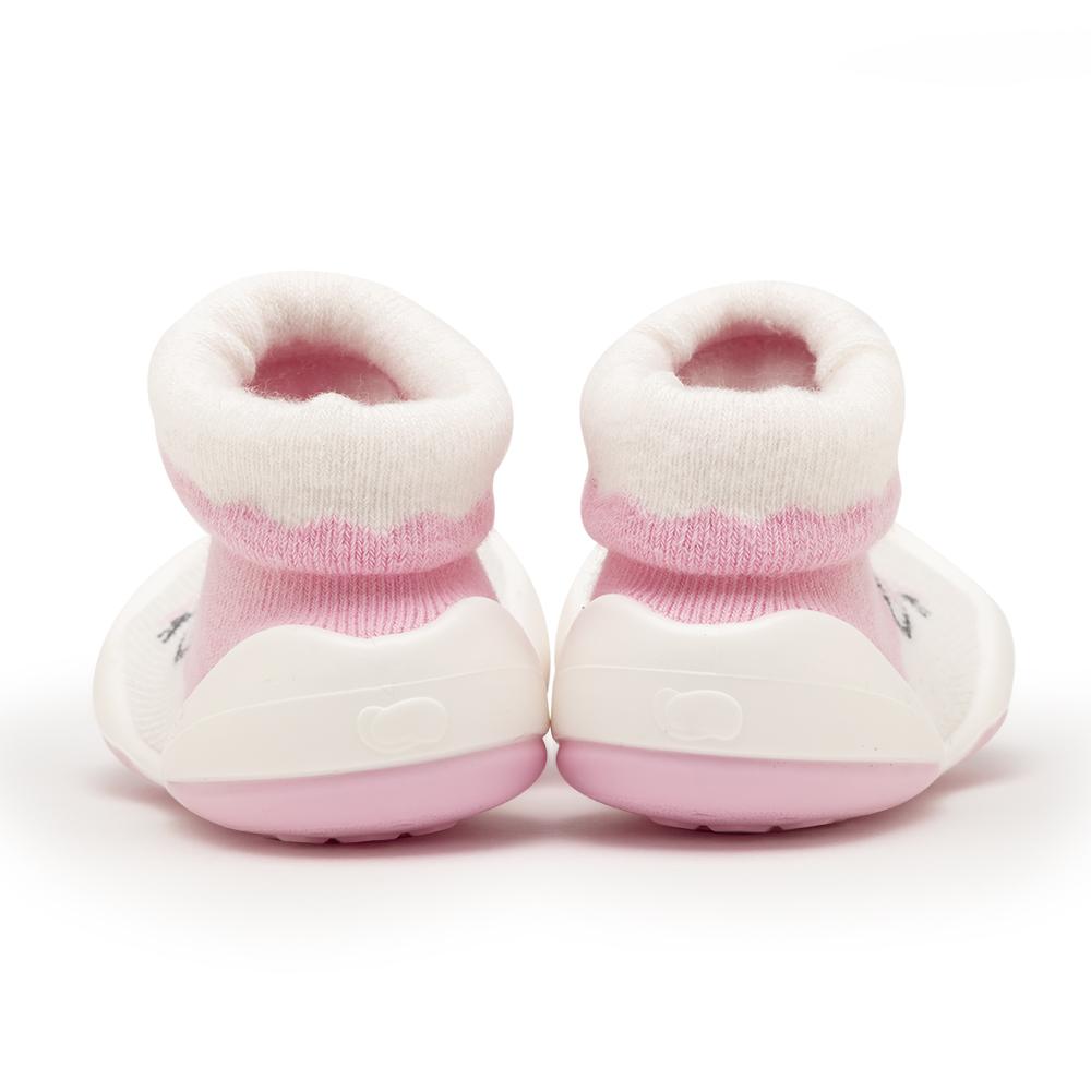 Pair of pink and white baby booties.