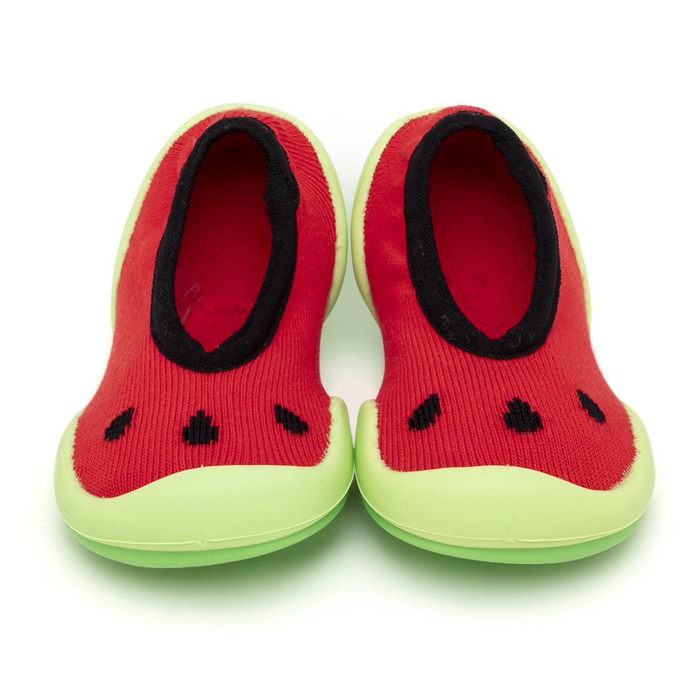 A pair of watermelon-themed baby shoes.