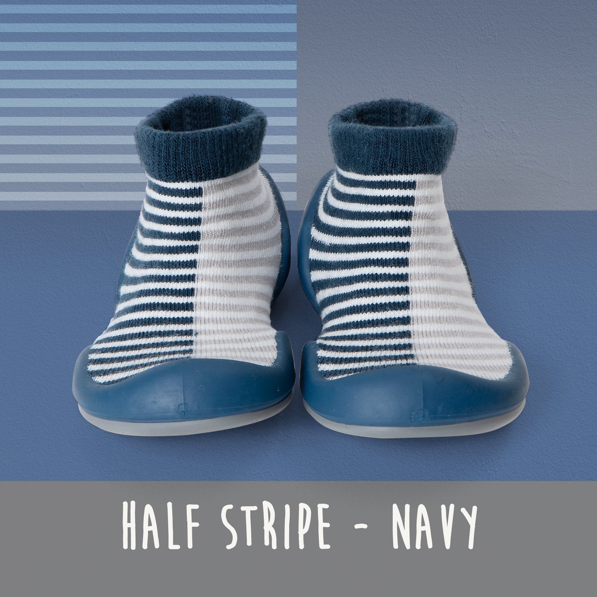 Two striped sock shoes, navy and grey, on a blue background.