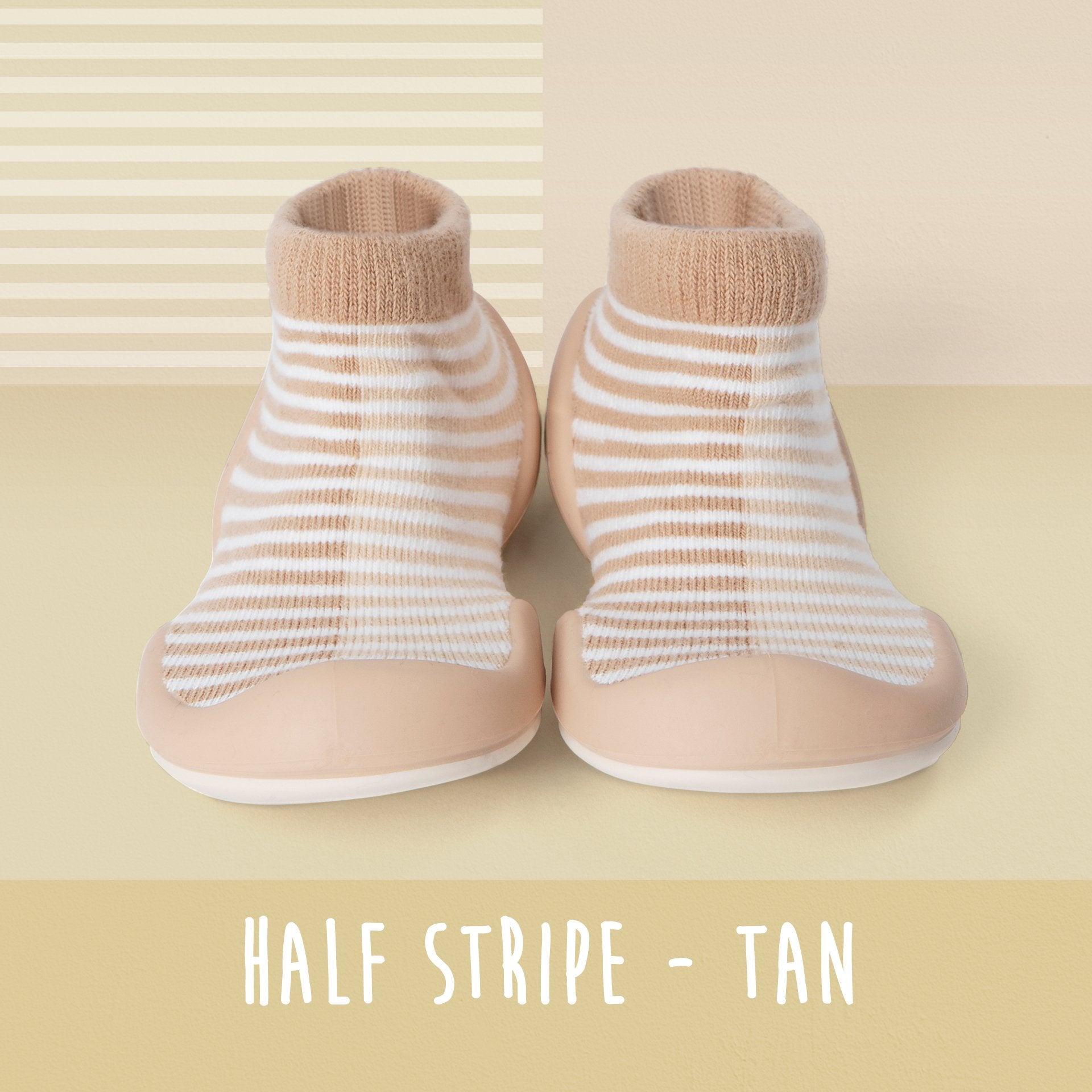 Tan and white striped baby sock shoes.