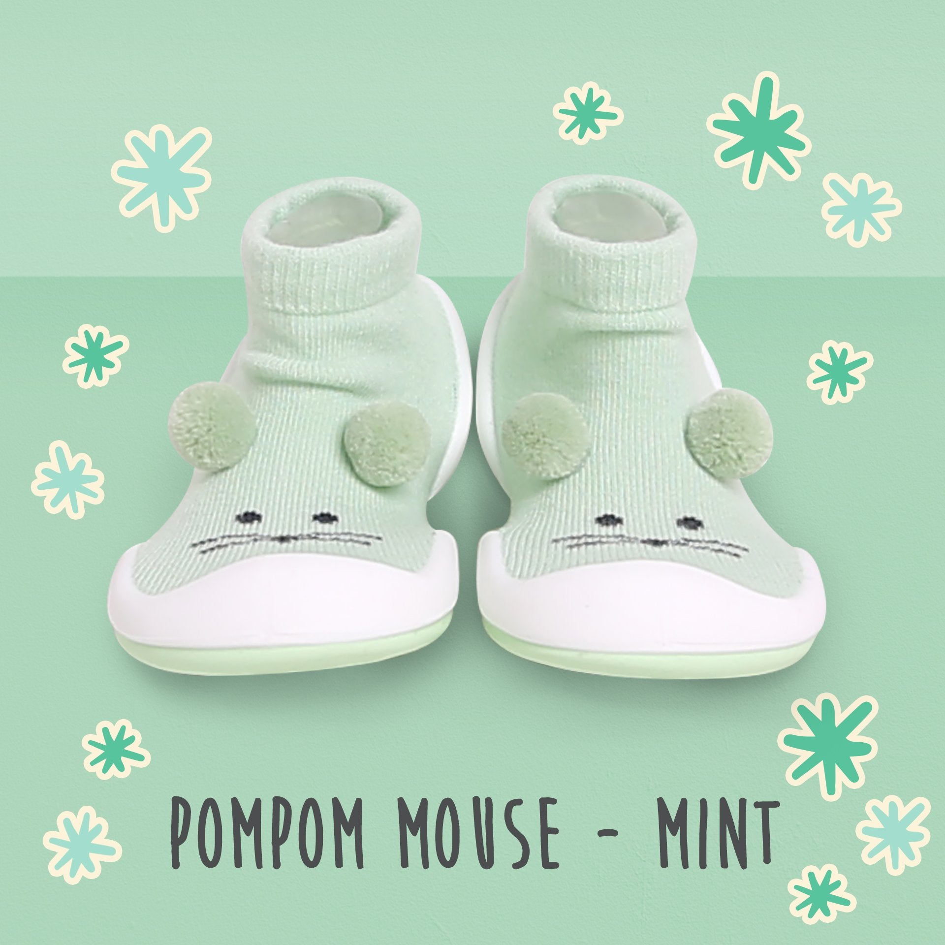 A pair of mint green baby shoes.