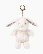Plush bunny keychain with floral headband on a white background