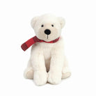 White teddy bear with a red bow tie on a white background