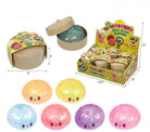 Mystery dim sum surprise toy packaging and loose squishy balls shown on a white background, with dimensions labeled and multiple color options including peach, yellow, blue, pink, purple, and light pink.