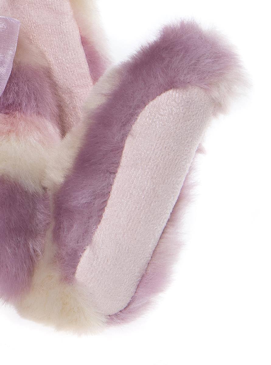 Close-up of a pink and purple fabric with a soft texture on a white background