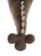 Plush toy resembling a dinosaur with a long tail and feet on a white background