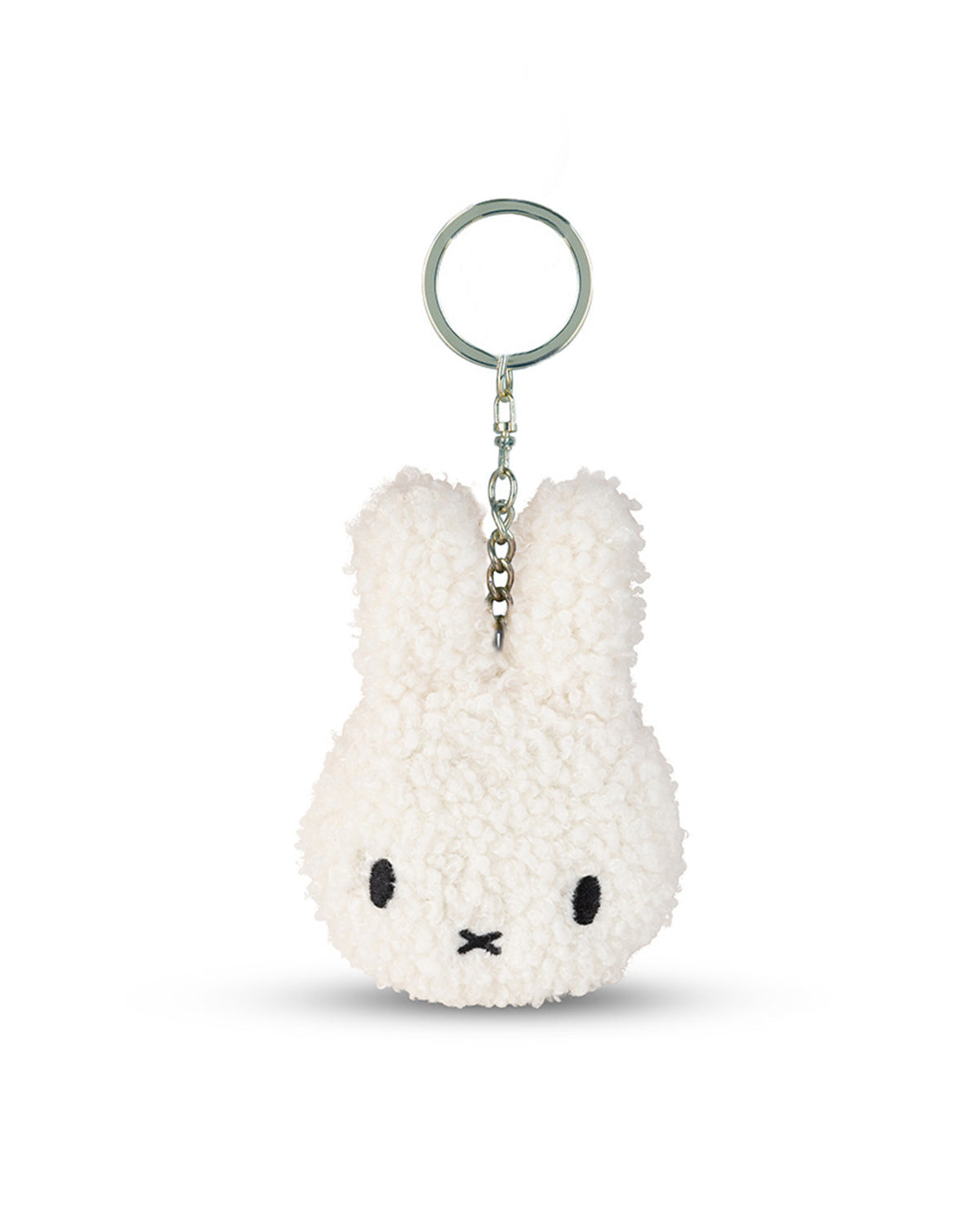 White plush keychain with a face on a white background
