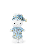 Stuffed toy with a blue nightcap and pajama set on a white background