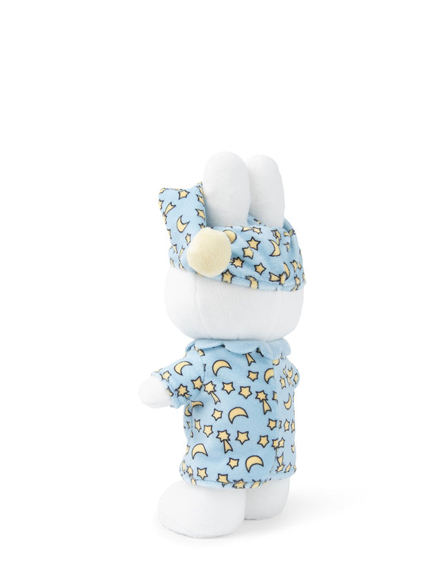 White plush toy with a blue outfit featuring yellow stars and moons on a white background