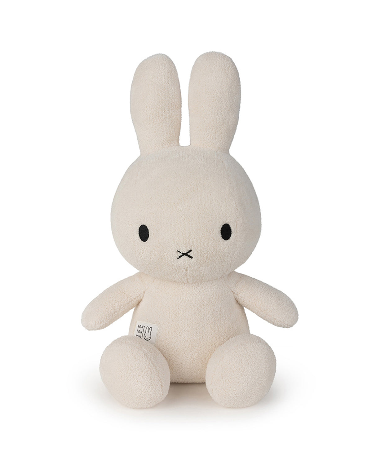 Beige plush rabbit toy on a white background