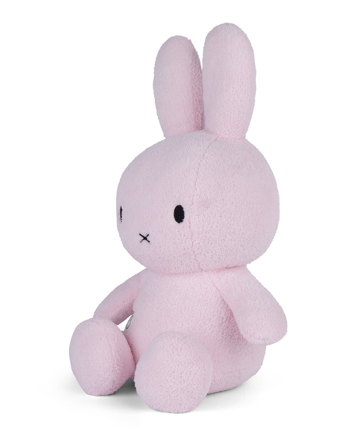Pink plush bunny toy on a white background