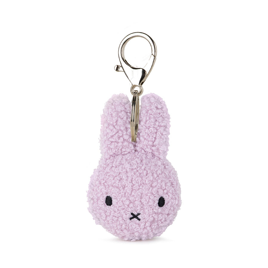 Purple plush keychain with a metal clip on a white background