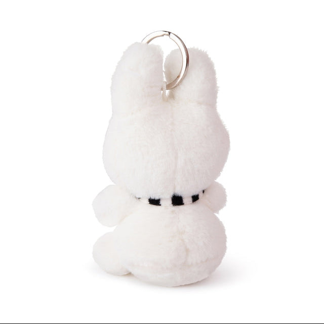 White plush keychain with a black belt on a white background
