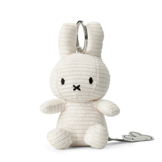 Off-white corduroy bunny keychain with silver ring.
