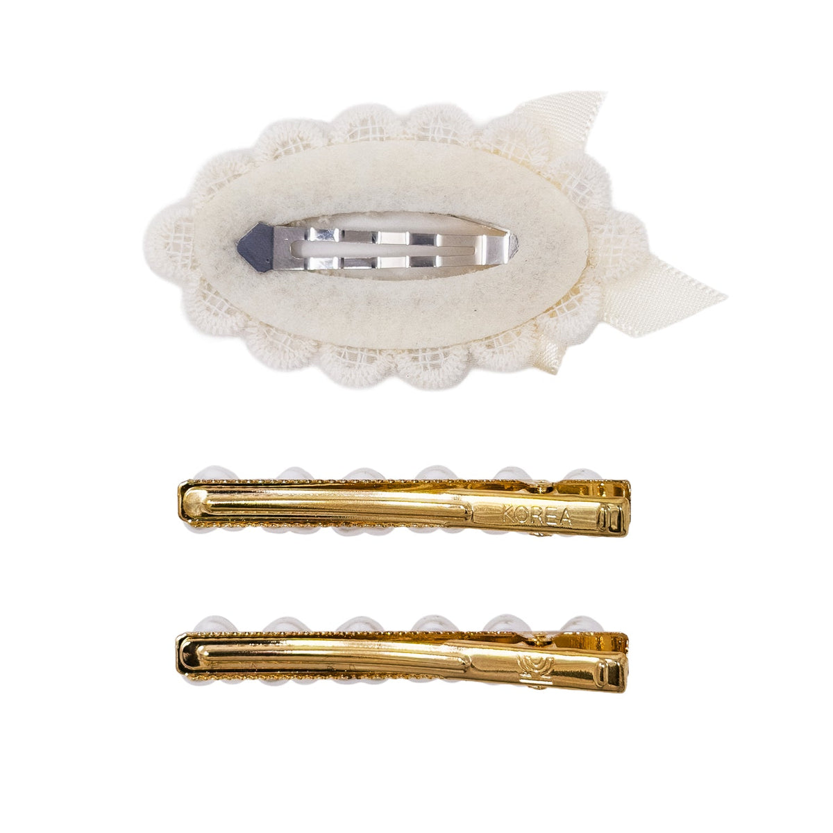 Three hair clips shown on a plain white background: one cream lace hair clip with a silver metal clip, and two gold metal hair clips with pearl-like accents.