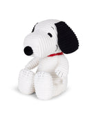 Plush dog toy with black ears and red collar on a white background