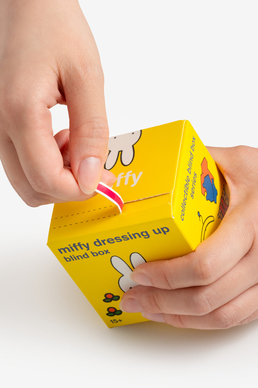 Yellow blind box with cartoon character on a white background