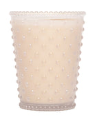 Ceramic candle holder with pearl-like texture on a white background