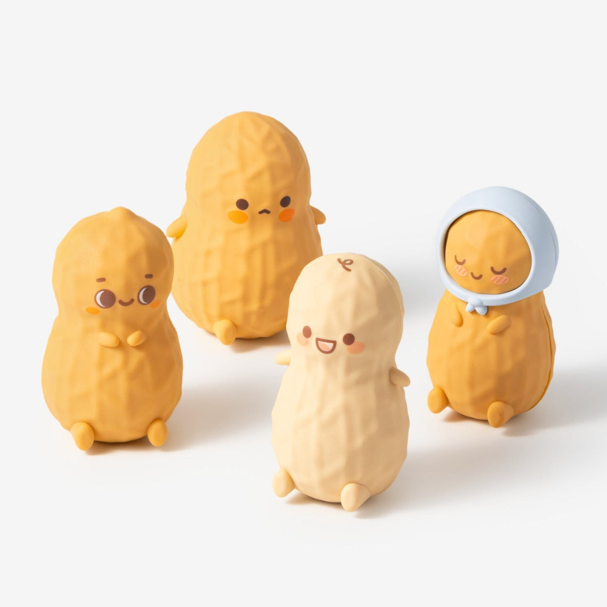 Four yellow character figurines with different expressions on a white background