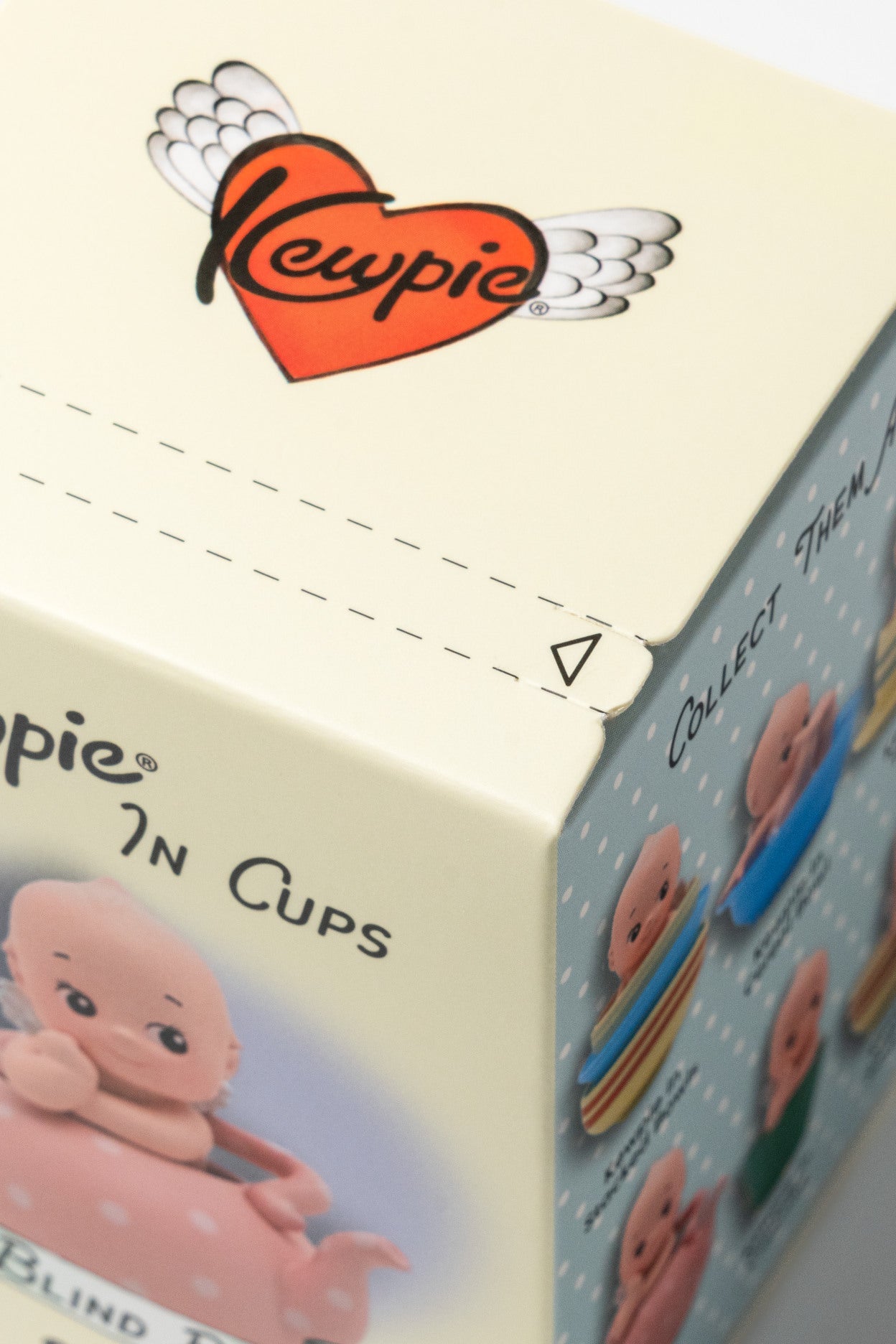 Close-up of a box featuring the Lewpie brand with illustrations of baby-like figures.