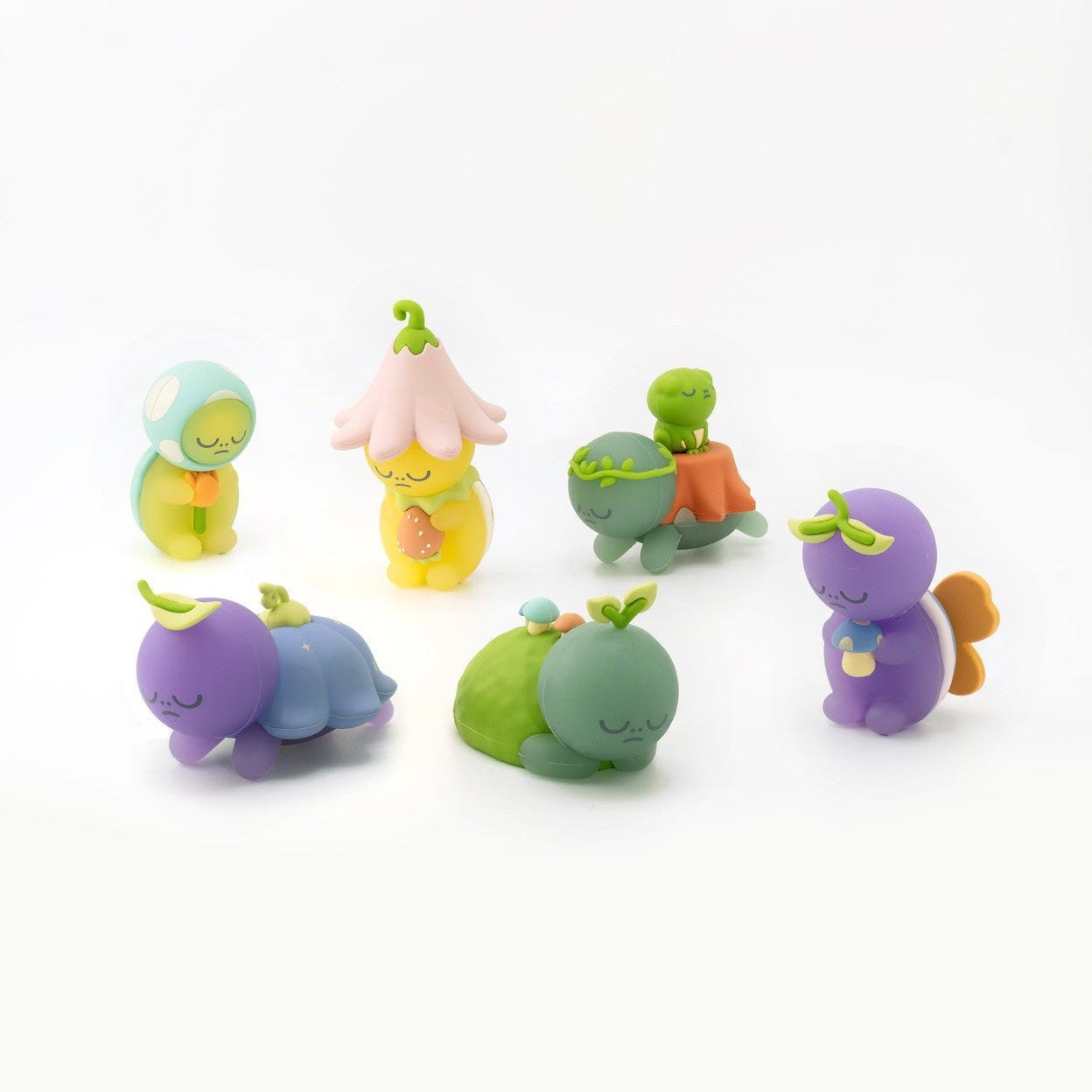Set of colorful toy figures on a white background