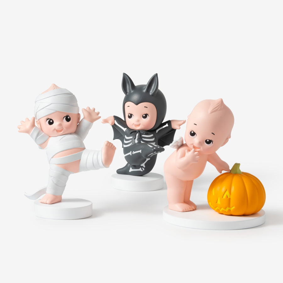 Three Halloween-themed figurines on a white background