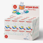 A Moomin Reads Blend Box display carton showing multiple small milk carton packs arranged inside a branded retail display. The packaging features the Moomin character Moomin reading with books, red 'MOOMIN READS' text, and a white background.