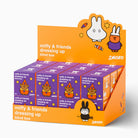 SMOKO Miffy & friends dressing up blind box display stand with multiple purple and orange boxes arranged in a retail counter display against a white background.