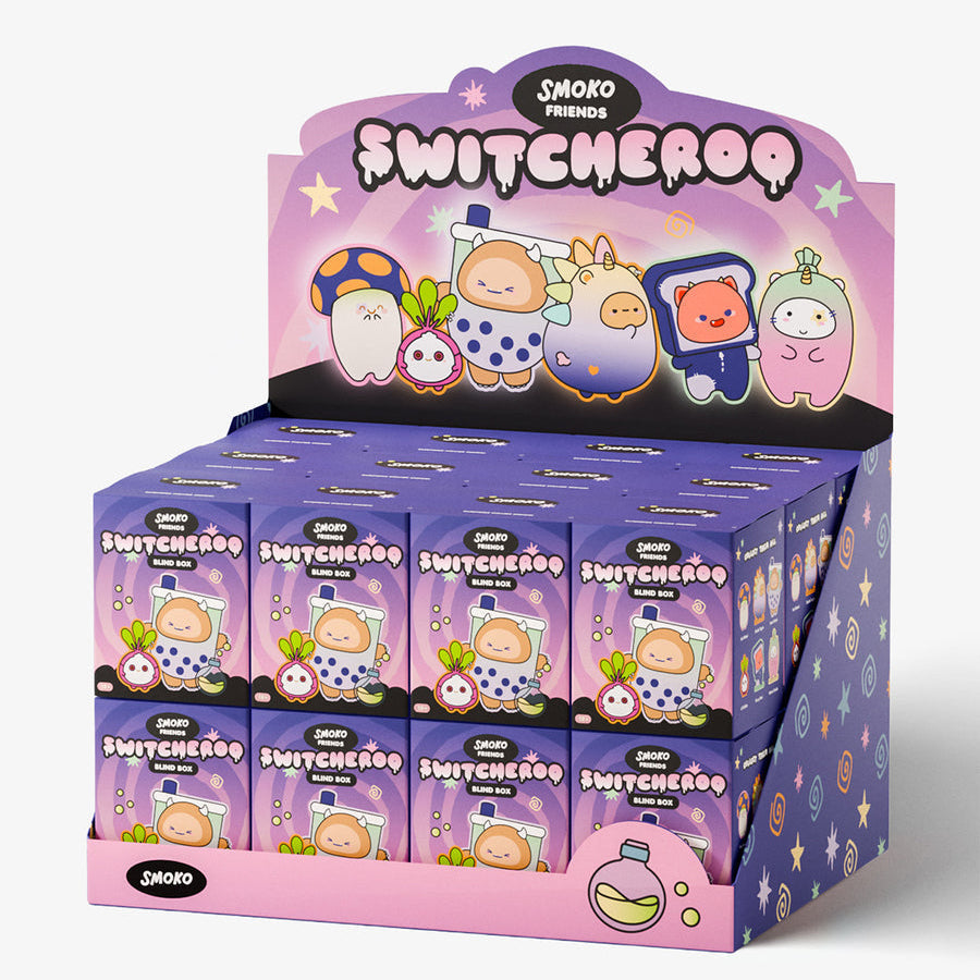 A retail display box filled with small purple Swomo Switcheroo mystery blind boxes, shown on a clean light gray studio background.