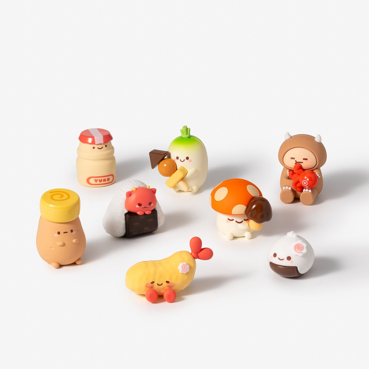 Set of small figurines on a white background