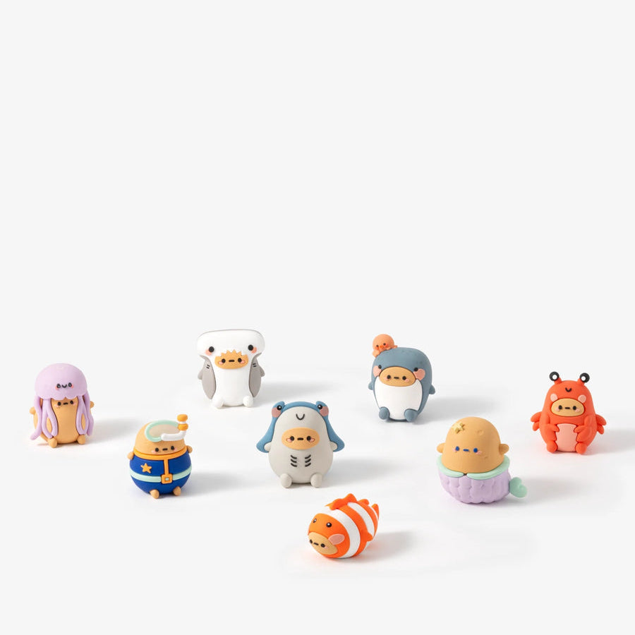 Set of small colorful figurines on a white background